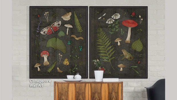 Two framed botanical wall art pieces above a wooden cabinet with a floral rug on the floor.